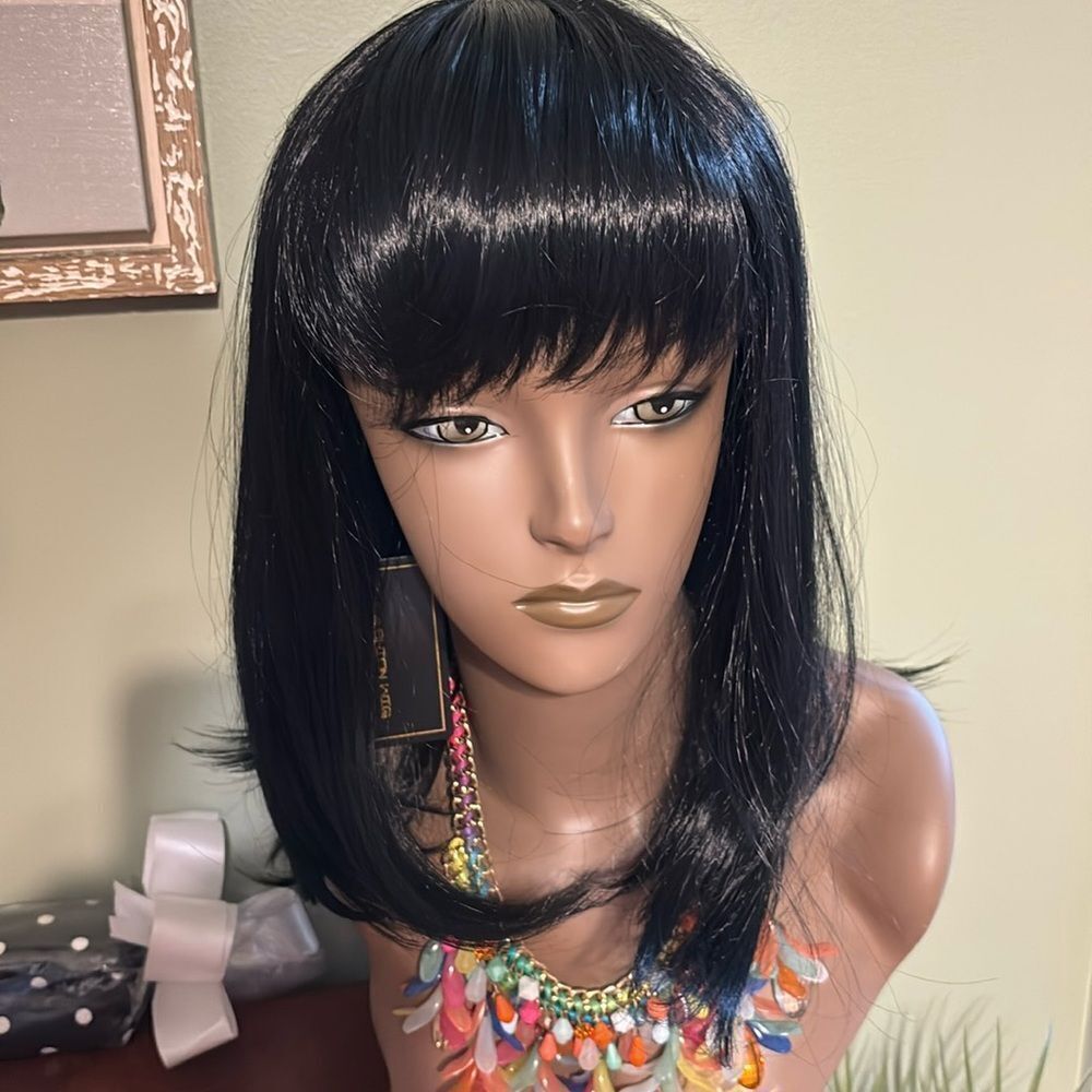 100% heat resistant synthetic wig. Dark dark brown or black?  See photos